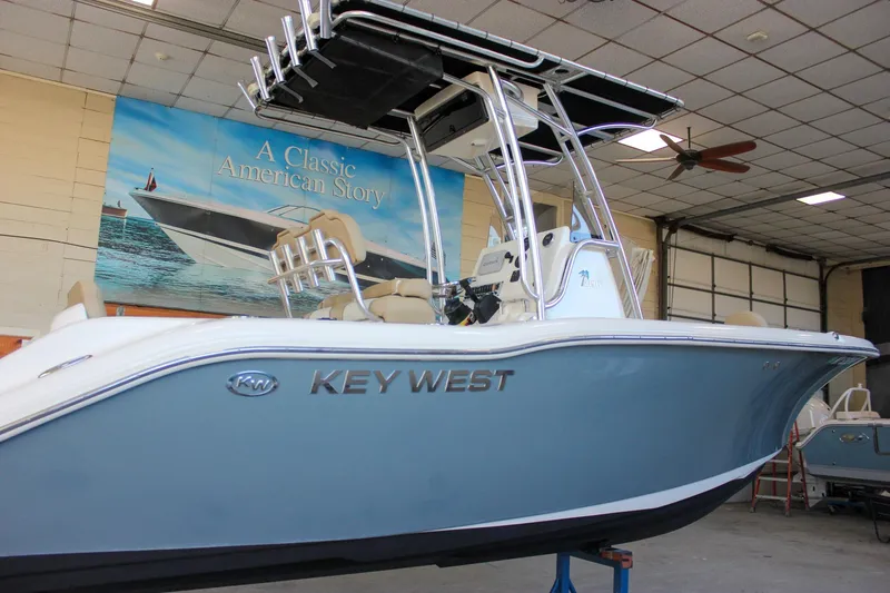 Slide: The Image of 2018 Key West 219 FS boat in showroom, featuring sleek design and modern features. - 7
