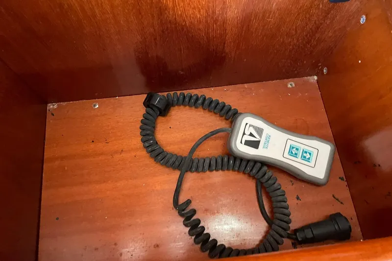 Slide: The Image of Remote control device in wooden compartment of 2000 Beneteau Oceanis 361 sailboat. - 23