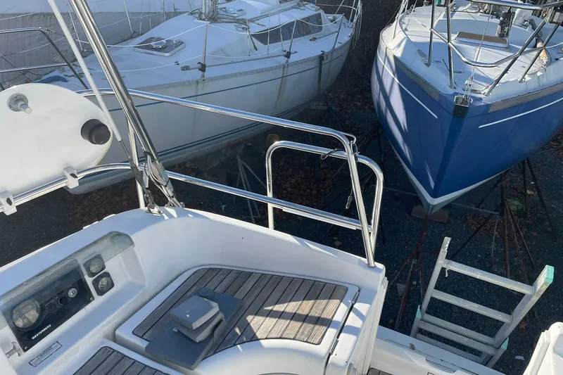 Slide: The Image of Beneteau Oceanis 361 sailboat, year 2000, docked alongside other boats in a marina. - 4