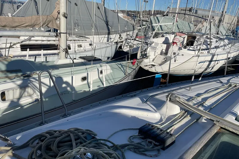 Slide: The Image of Beneteau Oceanis 361 sailboats docked in a marina, showcasing nautical equipment. - 15