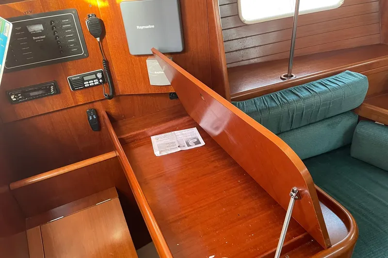 Slide: The Image of Interior of 2000 Beneteau Oceanis 361 sailboat with navigation equipment and wooden desk. - 19