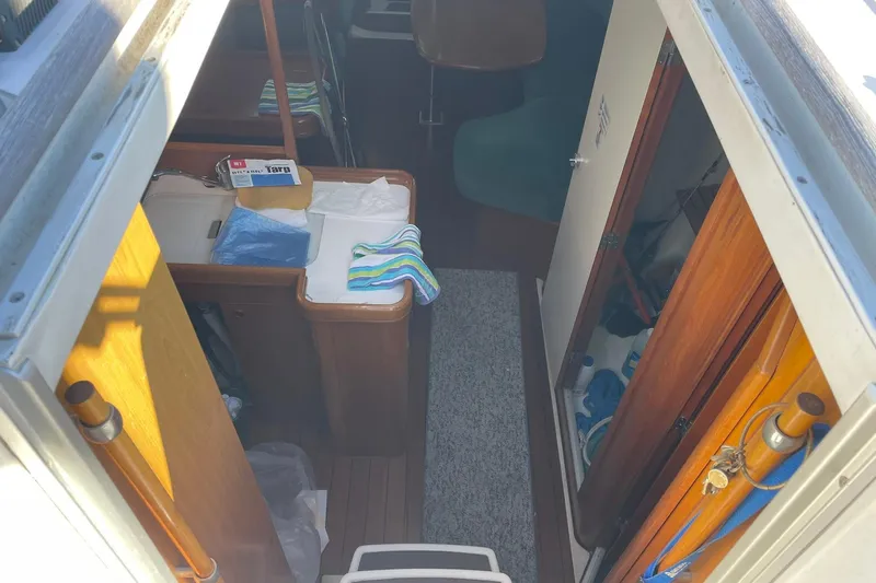 Slide: The Image of Interior view of 2000 Beneteau Oceanis 361 sailboat, featuring cabin and storage areas. - 20