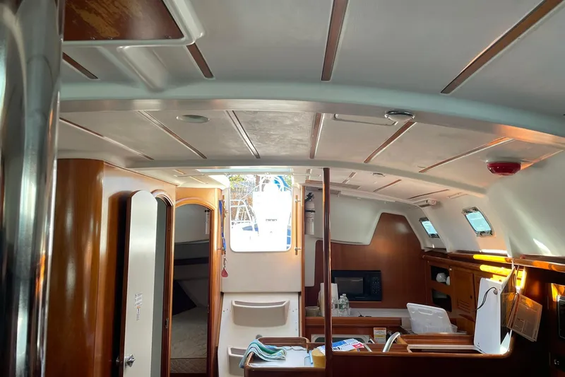 Slide: The Image of Interior of 2000 Beneteau Oceanis 361 sailboat, featuring wood finishes and modern amenities. - 27