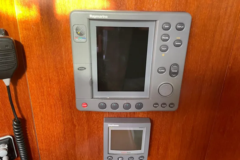 Slide: The Image of Raymarine navigation equipment on 2000 Beneteau Oceanis 361 yacht, featuring control panels. - 31