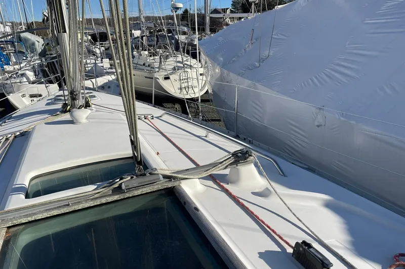 Slide: The Image of Beneteau Oceanis 361 sailboat deck, 2000 model, docked with other boats in marina. - 5