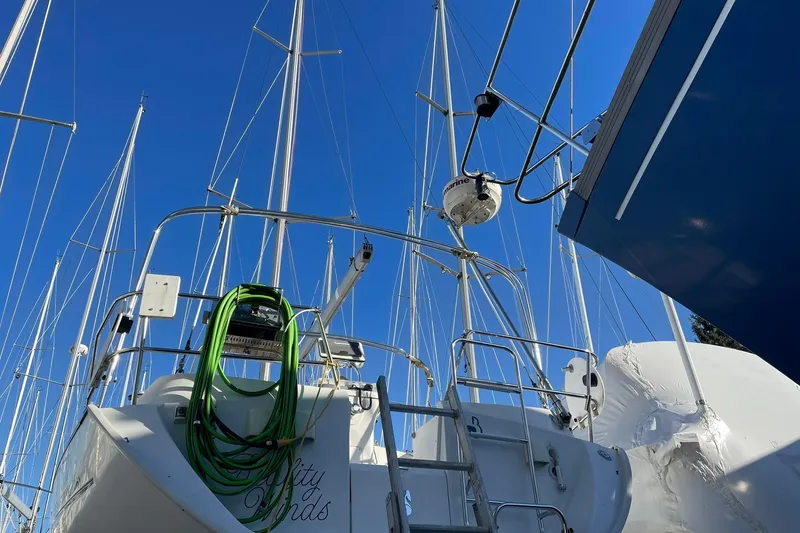 Slide: The Image of Beneteau Oceanis 361 sailboat from 2000, docked with clear blue sky background. - 8