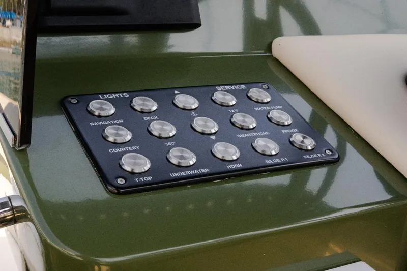 Slide: The Image of Control panel on 2026 Lilybaeum Levanzo 25 Lounge Deck boat, featuring various function buttons. - 15