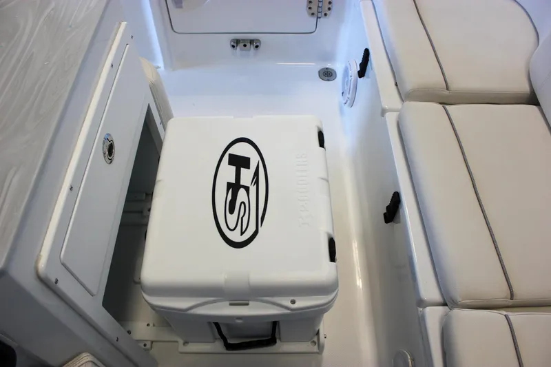 Slide: The Image of 2025 Sea Hunt Ultra 239 SE boat interior with seating and storage. - 22