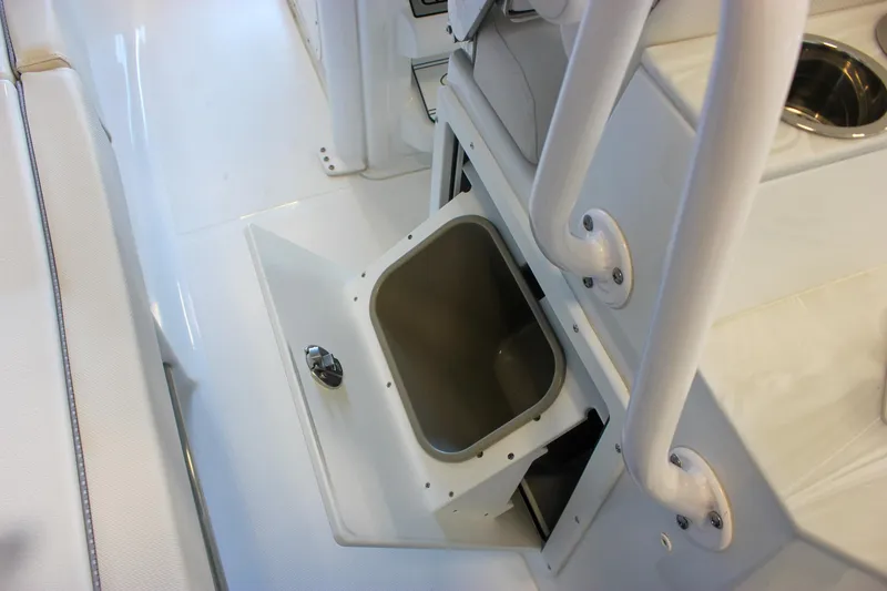 Slide: The Image of 2025 Sea Hunt Ultra 239 SE boat interior with open storage compartment. - 28