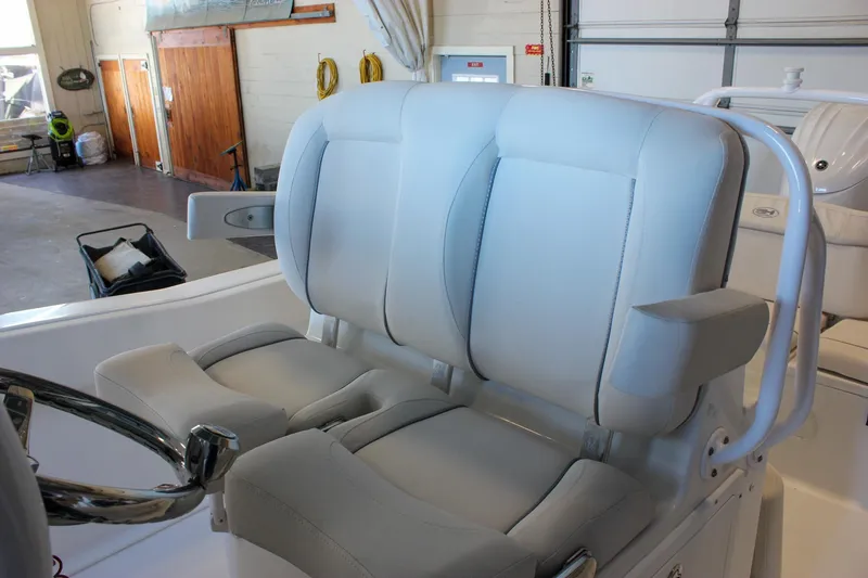 Slide: The Image of 2025 Sea Hunt Ultra 239 SE boat seats in a showroom setting. - 36