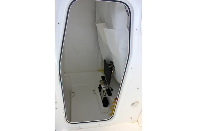 Slide: The Image of Interior view of 2025 Sea Hunt Ultra 239 SE boat storage compartment. - 44
