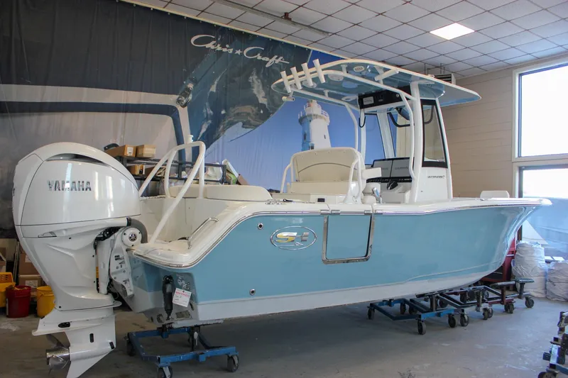 Slide: The Image of 2025 Sea Hunt Ultra 239 SE boat with Yamaha engine in showroom. - 56