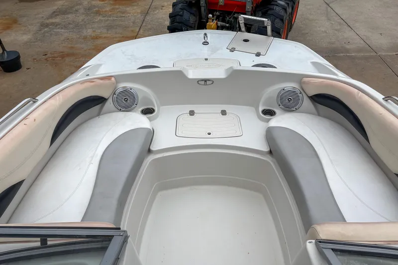 Slide: The Image of 2012 Tahoe 216 WT boat interior with cushioned seating and speakers. - 10