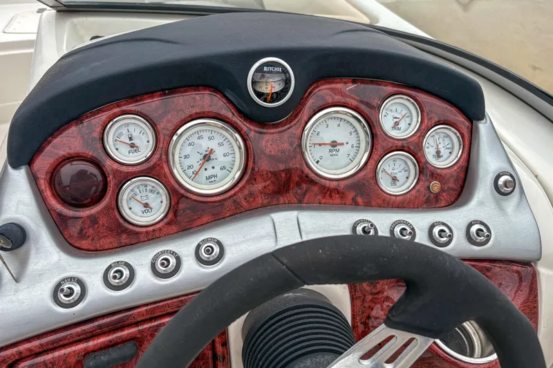Slide: The Image of Dashboard of a 2012 Tahoe 216 WT boat with gauges and controls. - 9