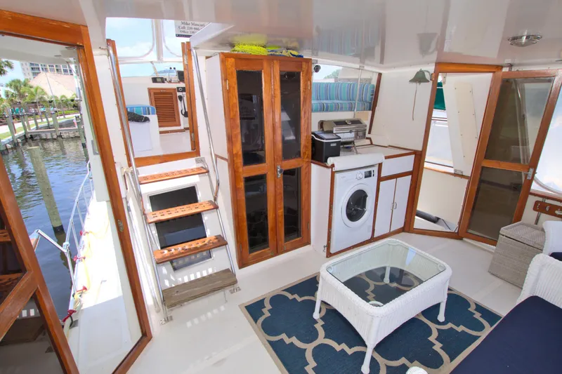 Slide: The Image of Interior of 1987 Jefferson 42 Sundeck yacht with stairs, washer, and seating area. - 22
