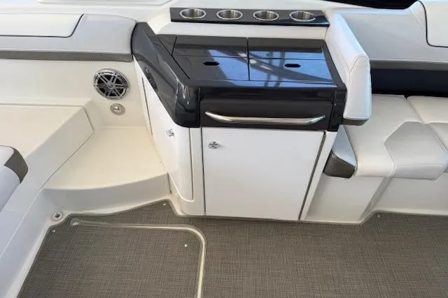 Slide: The Image of 2019 Formula 310 Bowrider I/O interior with sleek seating and storage area. - 17