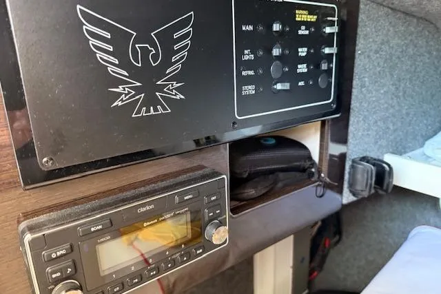 Slide: The Image of Control panel and stereo system inside a 2019 Formula 310 Bowrider I/O boat. - 4