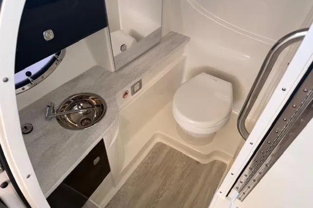 Slide: The Image of 2019 Formula 310 Bowrider I/O boat bathroom with sink and toilet. - 9