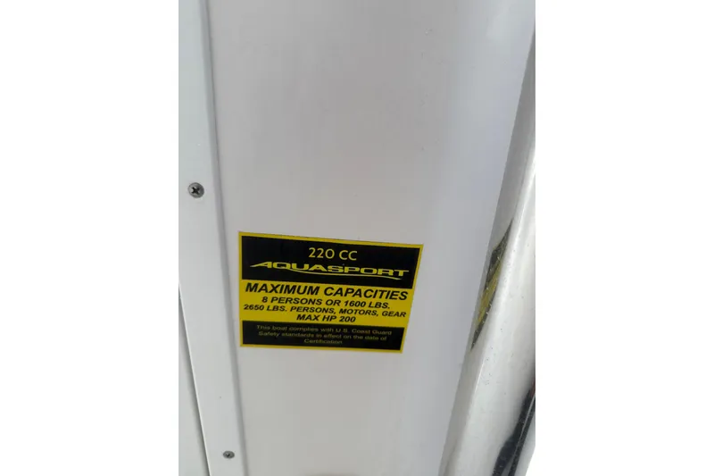 Slide: The Image of 2023 Aquasport 22CC capacity label, maximum 8 persons or 1600 lbs, 200 HP. - 10