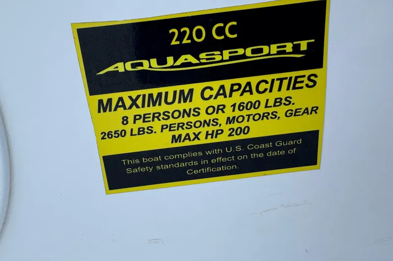Slide: The Image of 2023 Aquasport 22CC capacity label, 8 persons or 1600 lbs, max HP 200. - 9