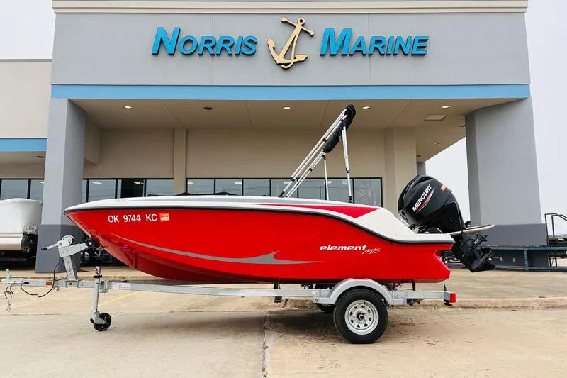 The Image of 2023 Bayliner Element M15 boat in red, parked at Norris Marine dealership. - 1