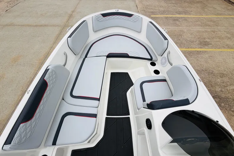 Slide: The Image of 2023 Bayliner Element M15 boat interior with cushioned seating and modern design. - 14