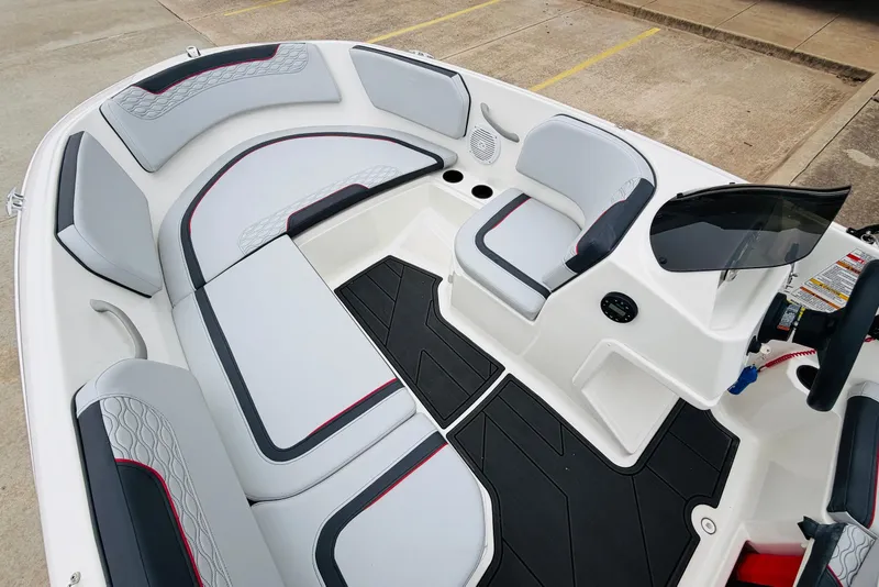 Slide: The Image of 2023 Bayliner Element M15 boat interior with modern seating and sleek design. - 16