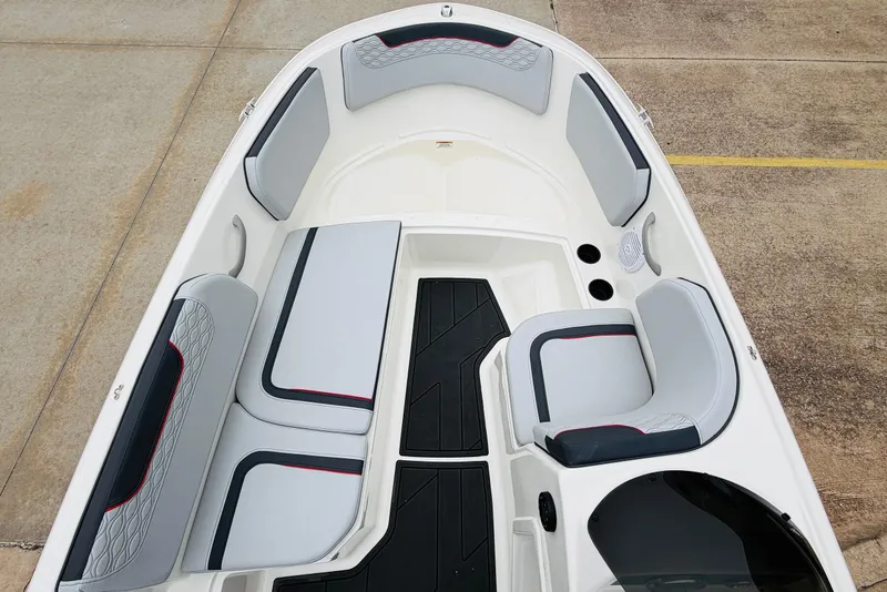 Slide: The Image of 2023 Bayliner Element M15 boat interior with gray seating and black accents. - 17