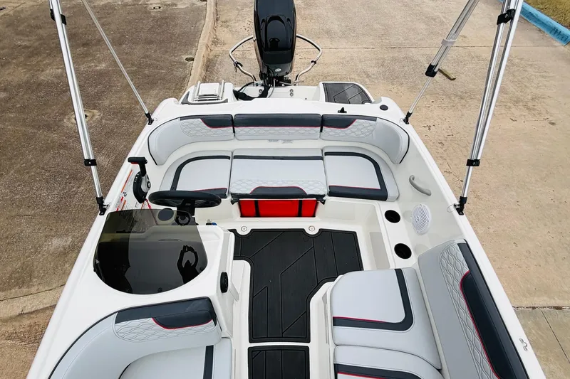 Slide: The Image of 2023 Bayliner Element M15 boat interior with seating and steering console. - 19