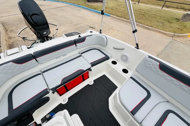 Slide: The Image of 2023 Bayliner Element M15 boat interior with cushioned seating and modern design. - 21