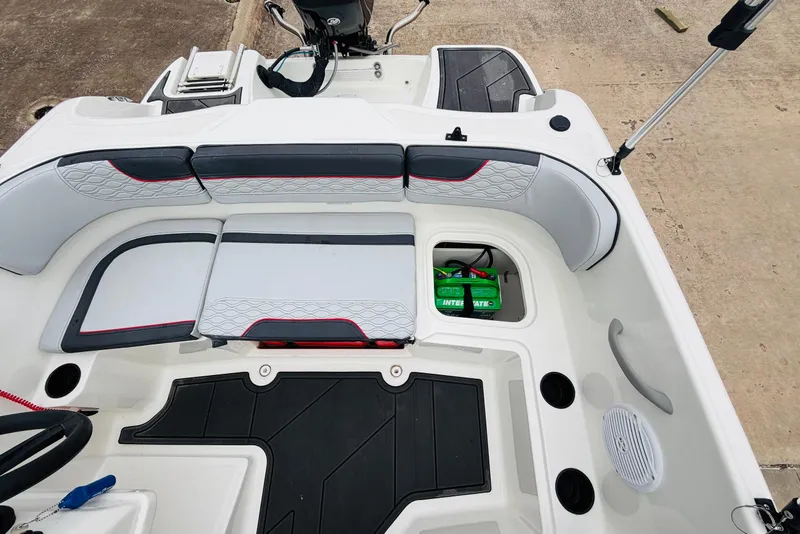 Slide: The Image of 2023 Bayliner Element M15 boat interior with seating and storage compartments. - 22