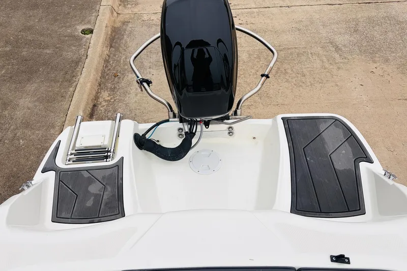 Slide: The Image of 2023 Bayliner Element M15 boat stern with motor and swim platform. - 27