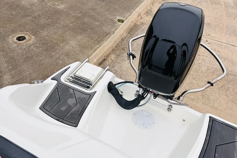 Slide: The Image of 2023 Bayliner Element M15 boat with outboard motor and swim platform. - 29