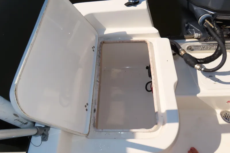 Slide: The Image of Open storage compartment on 2018 Key West 1720 Center Console boat. - 15