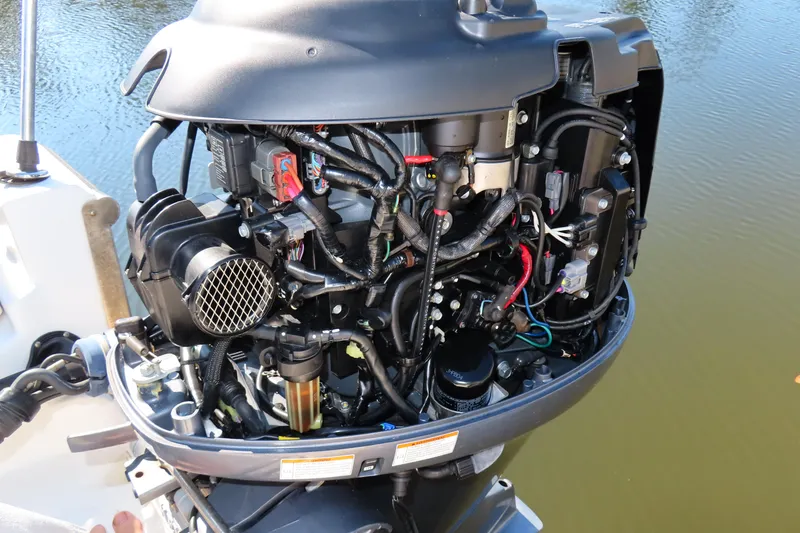Slide: The Image of Open engine of a 2018 Key West 1720 Center Console boat, showing detailed components. - 16