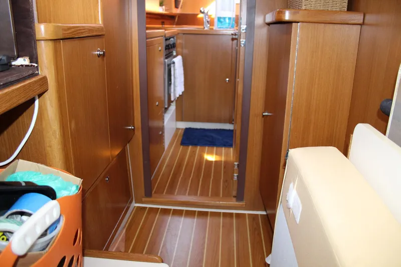 Slide: The Image of Interior of 2011 Catalina 445 sailboat with wooden cabinetry and flooring. - 17