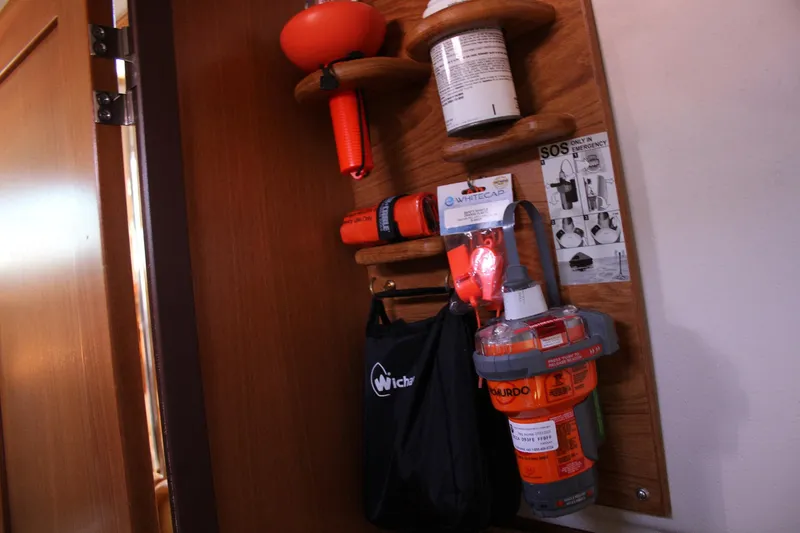 Slide: The Image of Safety equipment on a 2011 Catalina 445 sailboat, including emergency gear and instructions. - 18