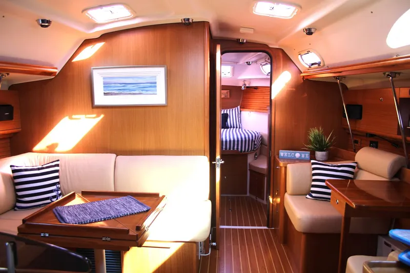 Slide: The Image of Luxurious interior of 2011 Catalina 445 sailboat with cozy seating and nautical decor. - 2