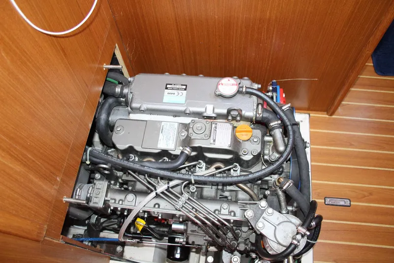 Slide: The Image of Engine compartment of a 2011 Catalina 445 sailboat, showcasing detailed mechanical components. - 20