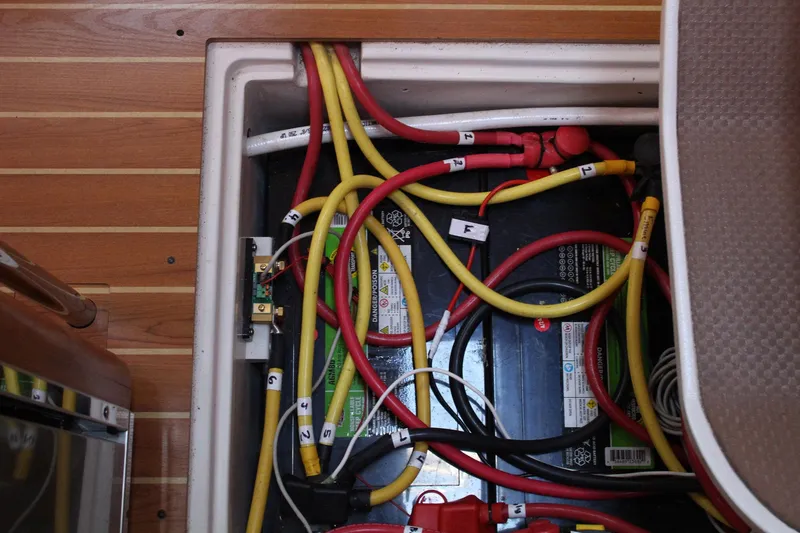 Slide: The Image of Electrical wiring and battery setup in a 2011 Catalina 445 sailboat. - 25