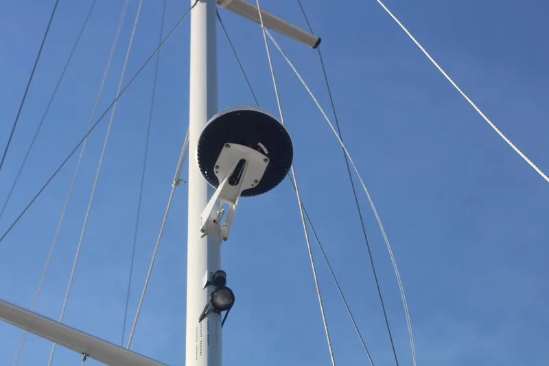 Slide: The Image of Mast of 2011 Catalina 445 sailboat with radar and rigging against blue sky. - 33