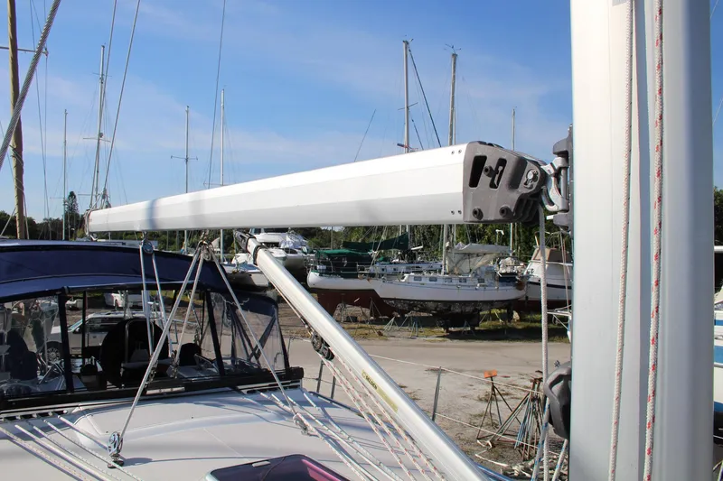 Slide: The Image of 2011 Catalina 445 sailboat with boom and rigging in a marina setting. - 34