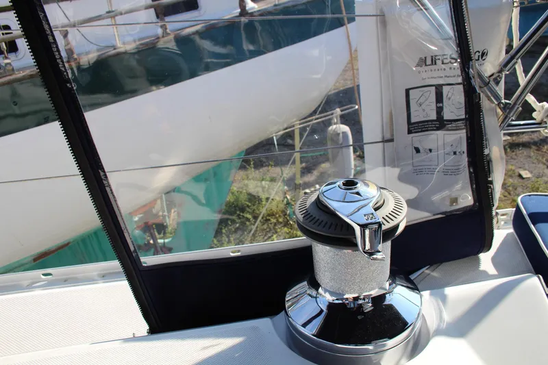 Slide: The Image of Catalina 445 sailboat cockpit with winch, 2011 model, featuring clear enclosure and equipment. - 40