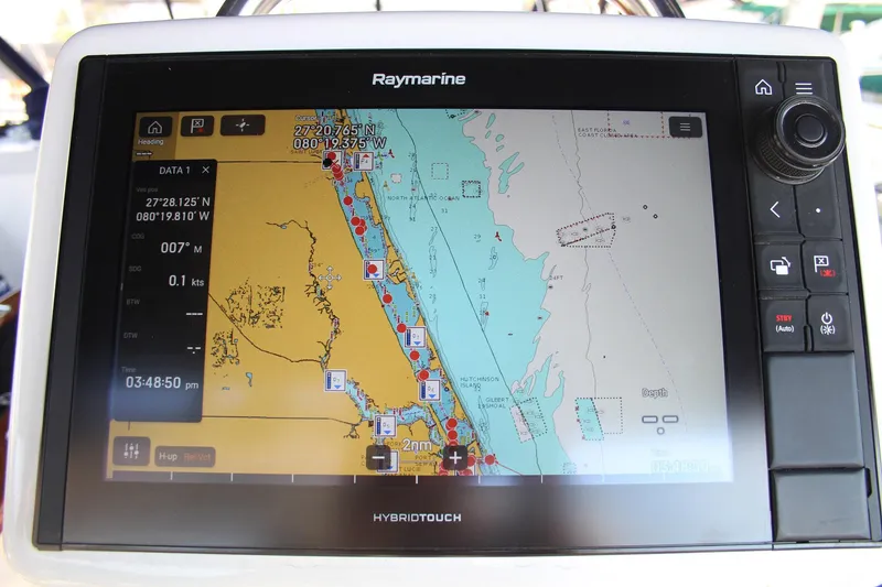 Slide: The Image of Raymarine navigation display on 2011 Catalina 445 sailboat, showing coastal map and coordinates. - 42