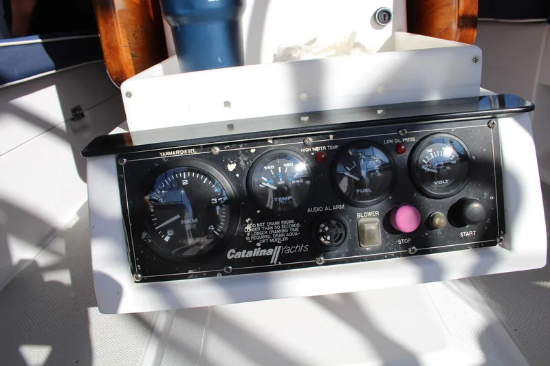 Slide: The Image of Control panel of a 2011 Catalina 445 yacht with gauges and switches. - 43