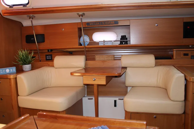 Slide: The Image of Luxurious interior of 2011 Catalina 445 yacht with beige seating and wooden accents. - 5