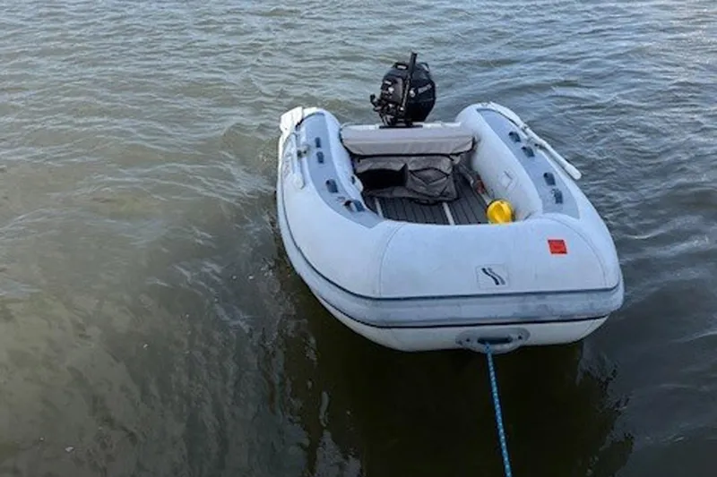 Slide: The Image of Inflatable dinghy with motor on water, Catalina 445, 2011 model. - 50