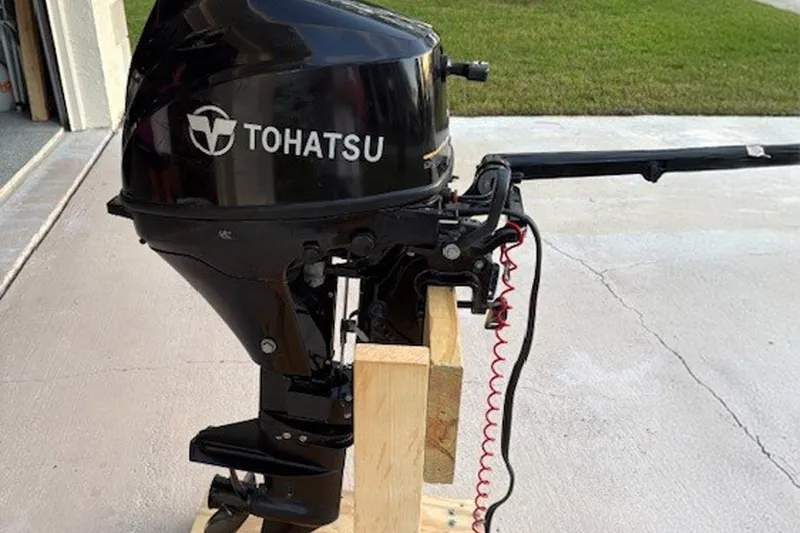Slide: The Image of Tohatsu outboard motor on a wooden stand, Catalina 445, 2011 model. - 51