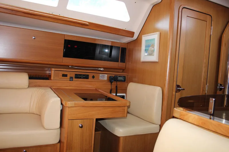 Slide: The Image of Luxurious interior of 2011 Catalina 445 yacht with wood finish and comfortable seating. - 6