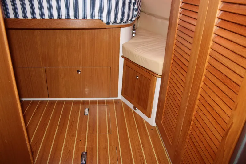 Slide: The Image of Interior of 2011 Catalina 445 sailboat with wooden flooring and cabinetry. - 9